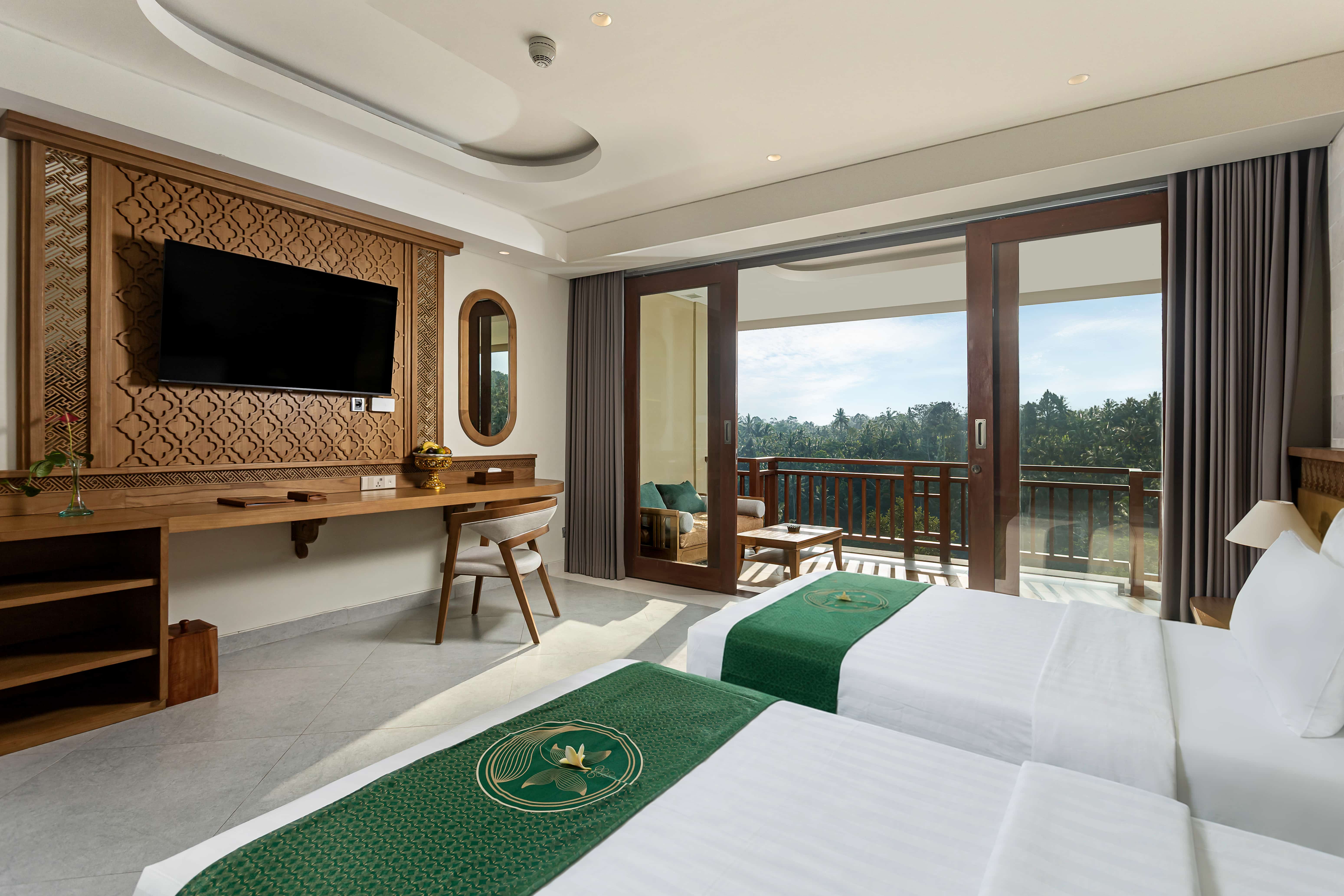 Luxury bedroom inside deluxe suite room in Ubud Bali with elegant decor