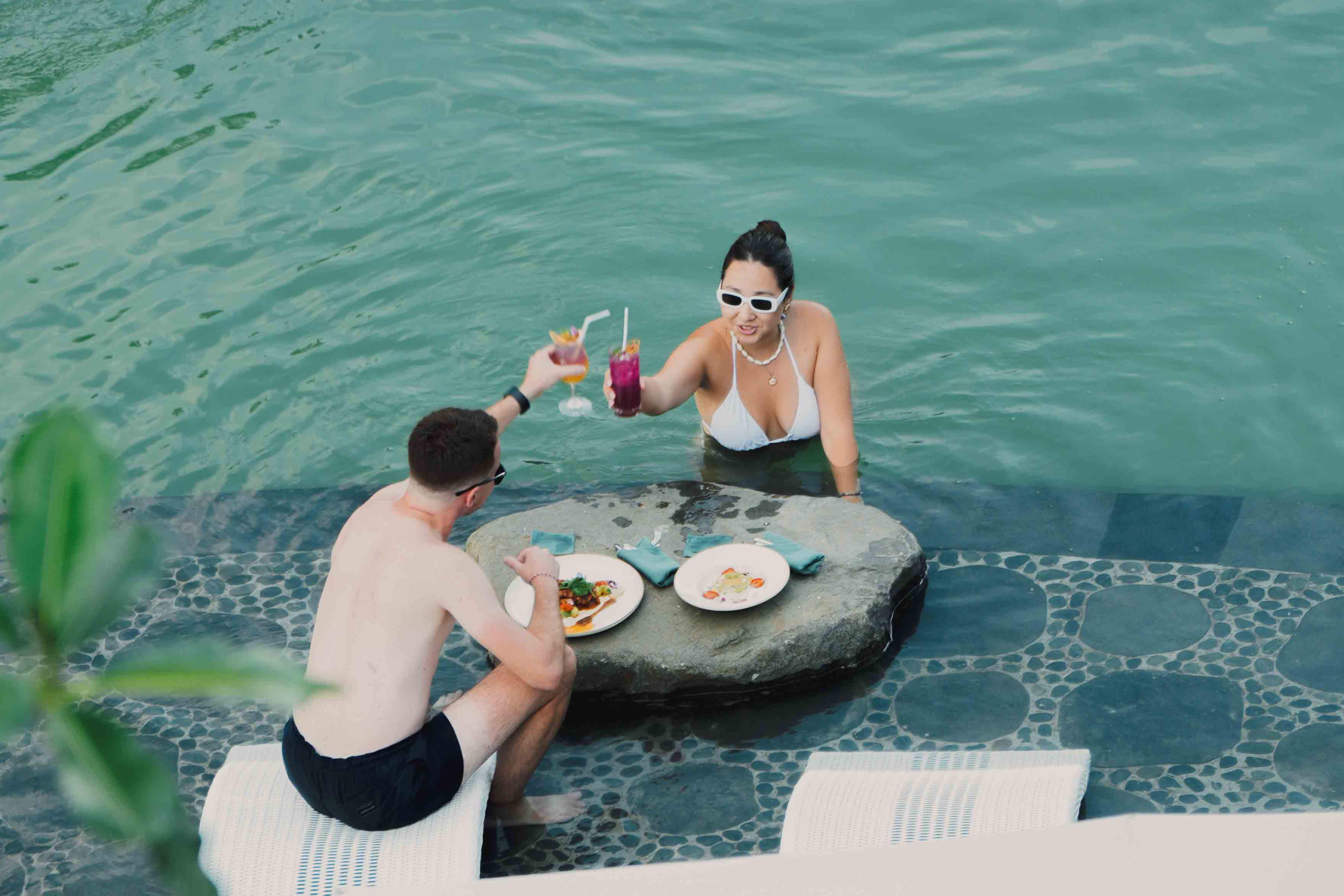 Sunken Pool Bar at Sanggraloka Ubud infinity pool swim-up bar surrounded by tropical rainforest atmosphere in Bali luxury resort