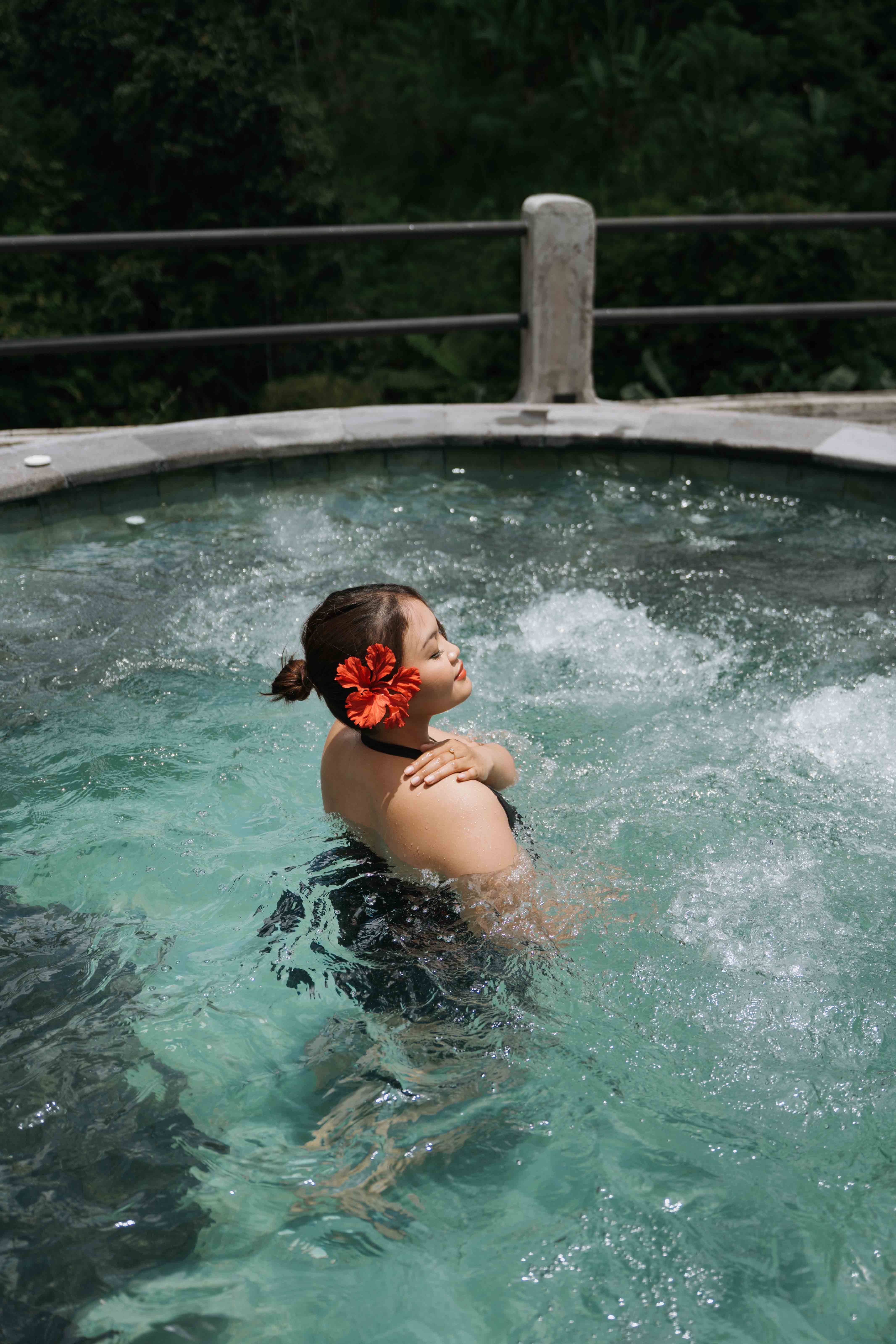 Jacuzzi spa pool at Sanggraloka Ubud luxury resort with warm hydrotherapy bubbles surrounded by tropical nature Bali wellness retreat