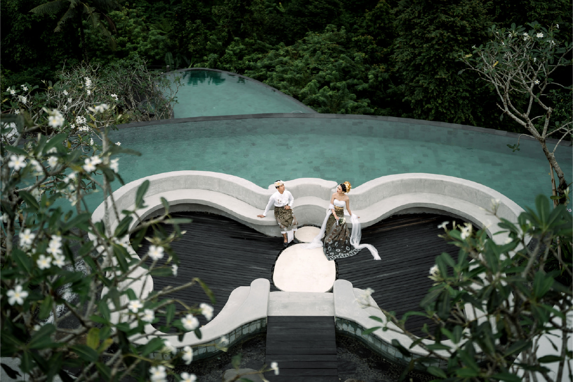 Romantic pre-wedding photography session in Ubud Bali with elegant resort backdrop